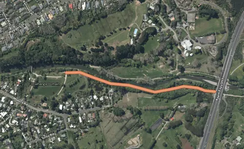 Aerial map of Ōtaihanga Domain showing an orange highlighted route following the Waikanae River between the domain and Kāpiti Expressway.