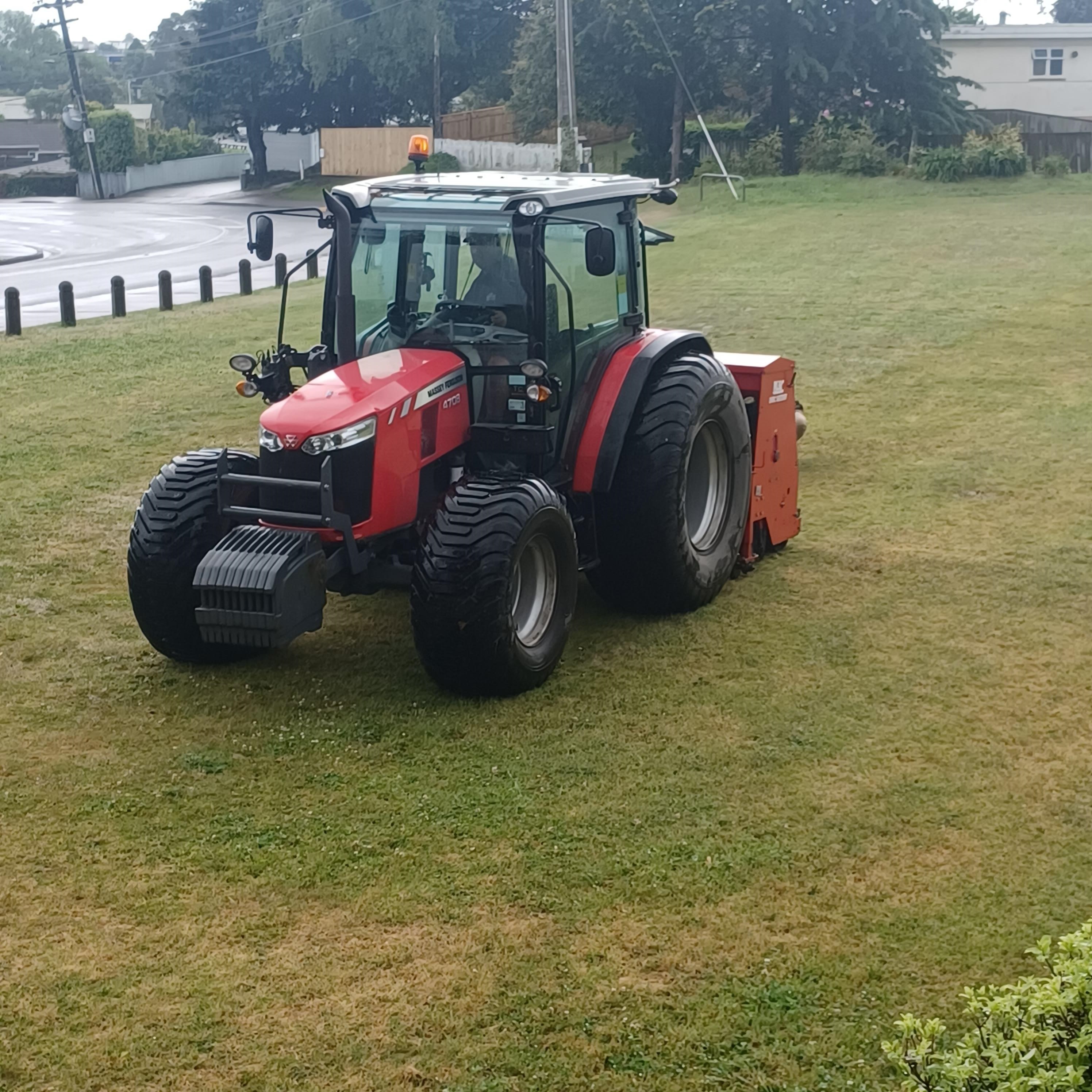 Photo of a tractor mowing grass on a Council reserve.