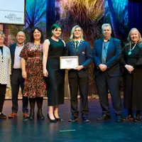 Fletcher Martin and his whānau on stage to accept his Rangatahi Award 28 Aug 2024 thumbnail