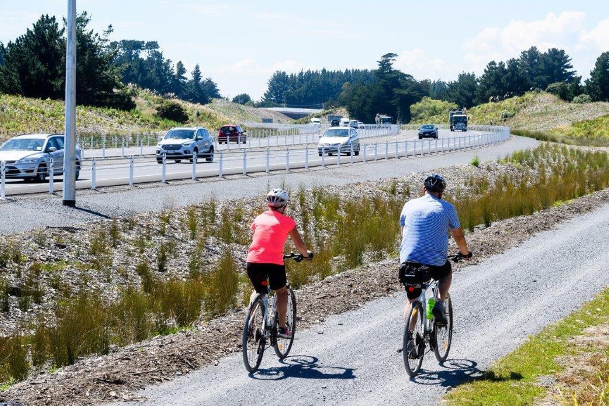 Two cyclists riding bikes 
