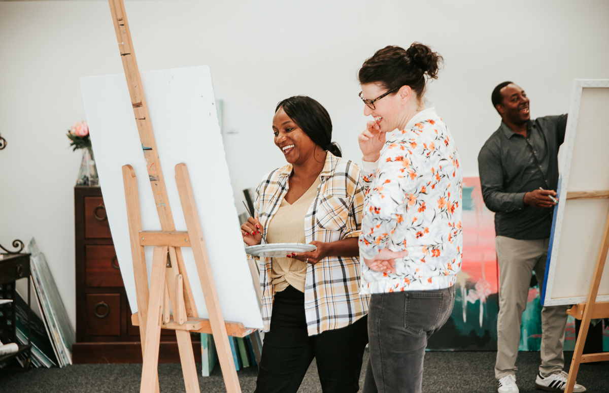 Previous Creative Communities Scheme recipient Jordan Harcourt-Hughes paints a canvas in her studio workshop, creative art.