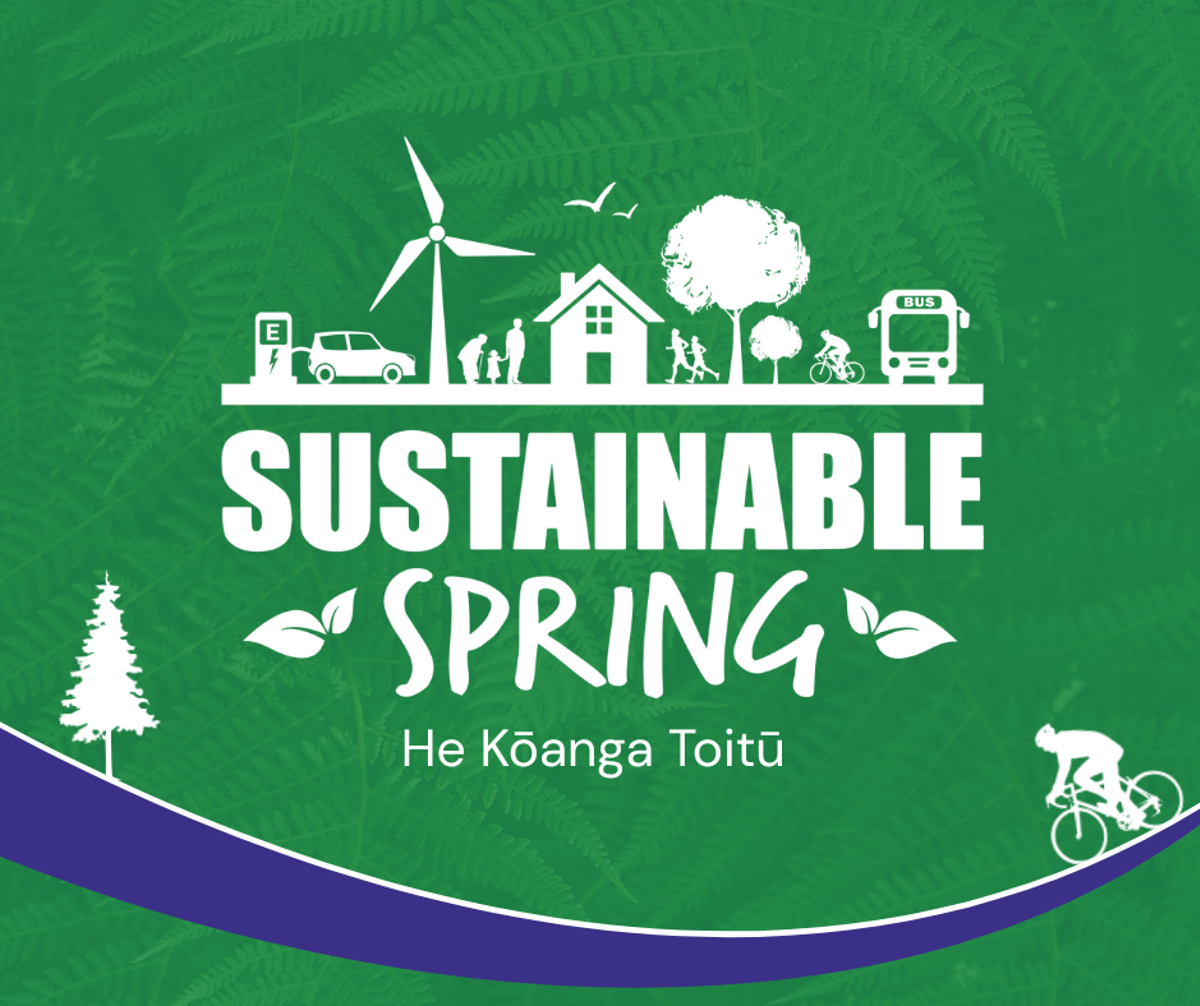 Green promotional graphic for Sustainable Spring / He Koanga Toitū. White illustrations across the top show an electric vehicle charging, a wind turbine, people walking, a house, trees, a cyclist and a bus, with birds flying overhead. Large white text reads “SUSTAINABLE SPRING” with smaller text below reading “He Koanga Toitū”. The background features fern fronds, with a curved purple border along the bottom and white silhouettes of a tree and cyclist in the lower corners.