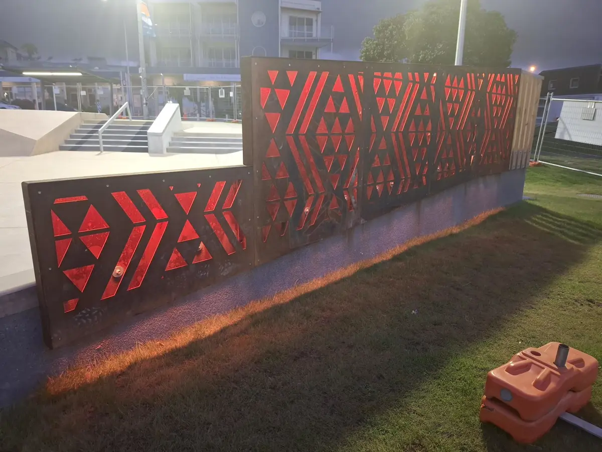 Waharua by artist Kereama Taepa lit red at night