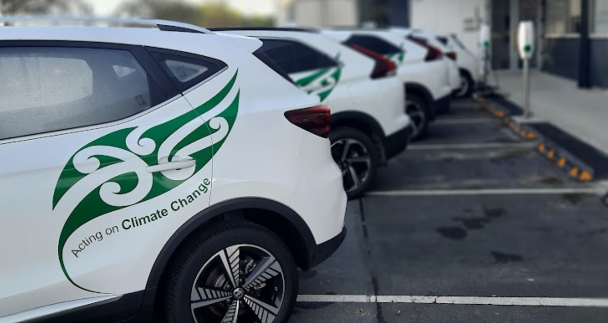Car with Acting on Climate Change logo on them.