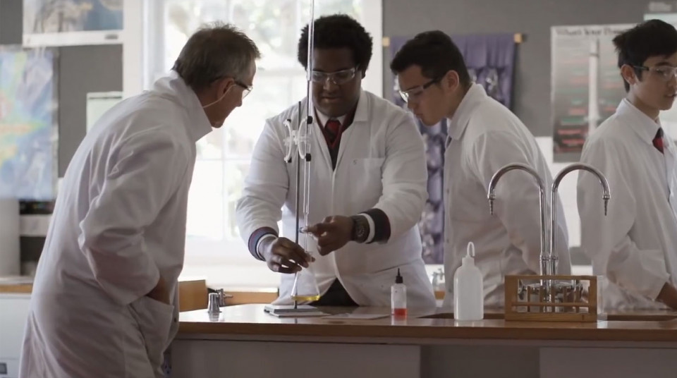 Three people working together in a lab
