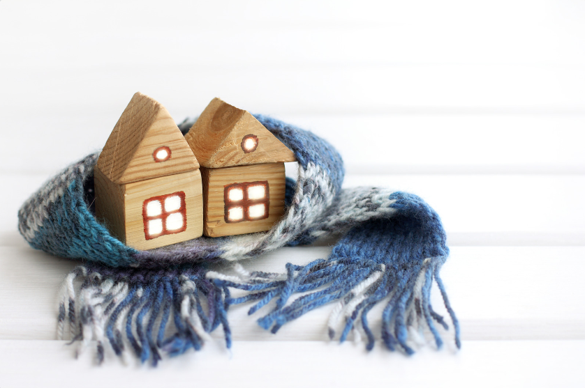 Photo of two model houses wrapped in a scarf