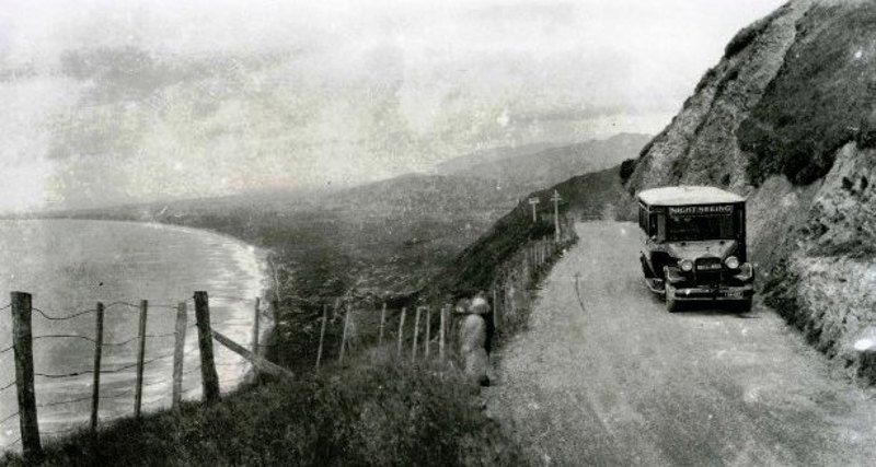 'Bell’ Company sightseeing bus on the summit of Paekākāriki Hill Road, view northwards ca 1920. Just Collection, Alexander Turnbull Library. Ref: 71442 ½