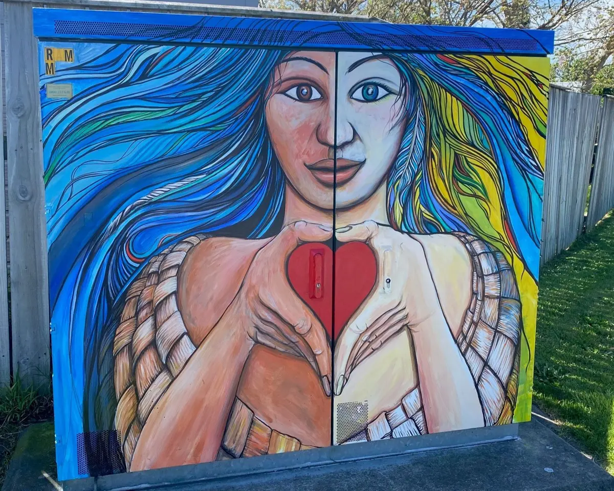 Painted cabinet of woman in two halves connected with a love heart