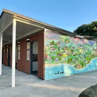 Maclean Park wharepaku with Kāpiti Captured mural by local artist Sarah Pou thumbnail