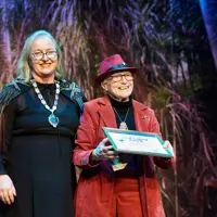 Sir Jon Trimmer's sister, Coral, accepts his Local Legend Award 28 August 2024 thumbnail
