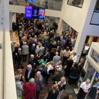 Crowd photo, with the Phil Simmons Band playing in the upper atrium. thumbnail
