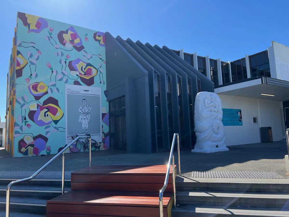 The entrance to the Waikanae Library building with it's colourful mural.