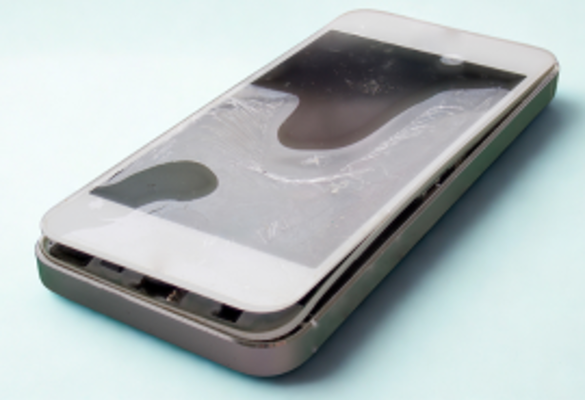 Damaged mobile phone with a swollen lithium-ion battery.