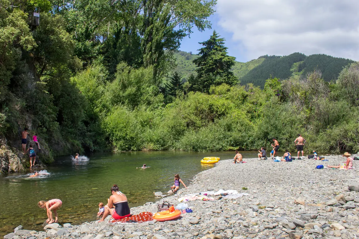 River inlet with many people enjoying the water