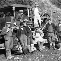 Caterpillar diesel bulldozer surrounded by a work gang, Centennial Highway, Paekākāriki, 1939 Hp 1031, J Beattie Collection, Kāpiti Coast District Libraries thumbnail