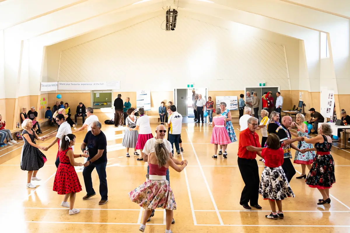 Community members dancing in community hall