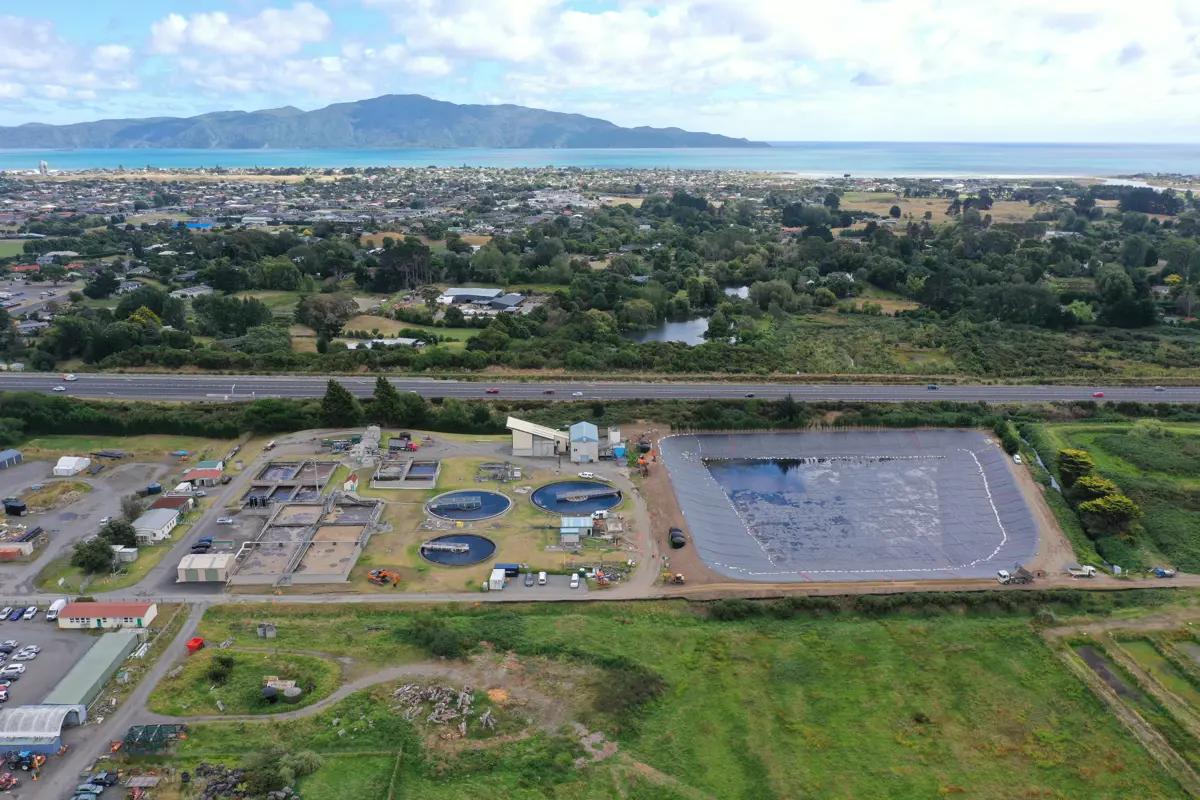 Aerial view of the Paraparaumu wastewater treatment plant with Kāpiti Island in the background. 