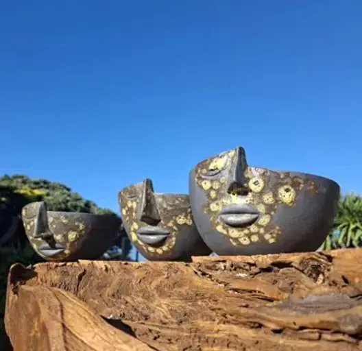 Neil Gardiner’s artwork, three half-head pots
