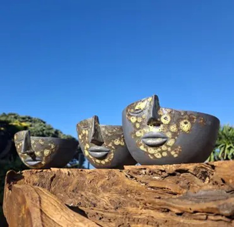 Neil Gardiner’s artwork, three half-head pots