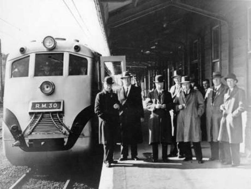 Railway officials beside the first standard railcar, Paekākāriki Railway Station, ca 1939.  HP 1512 Buckley Collection, Kāpiti Coast District Libraries