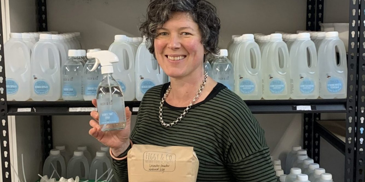 Jane, one of the founders of Figgy & Co standing in front of cleaning products