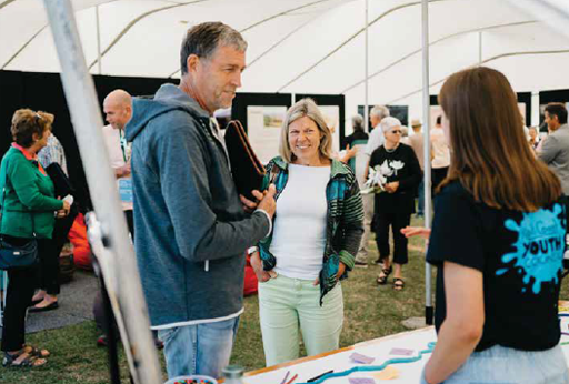 Photo of members of the community talking to a Youth Council member at one of our consultation pop-ups