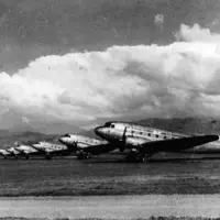Six DC3s tied down overnight to prevent wind damage, Paraparaumu Airport 1953. HP1485, Vaughn Collection, Kāpiti Coast District Libraries. thumbnail
