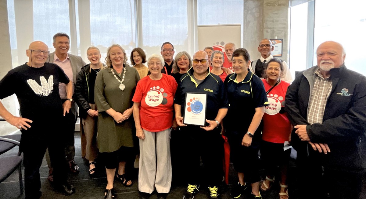 Living Wage Aotearoa representatives together with Mayor Janet Holborow, CEO Darren Edwards and Council staff celebrate the new Living Wage accreditation