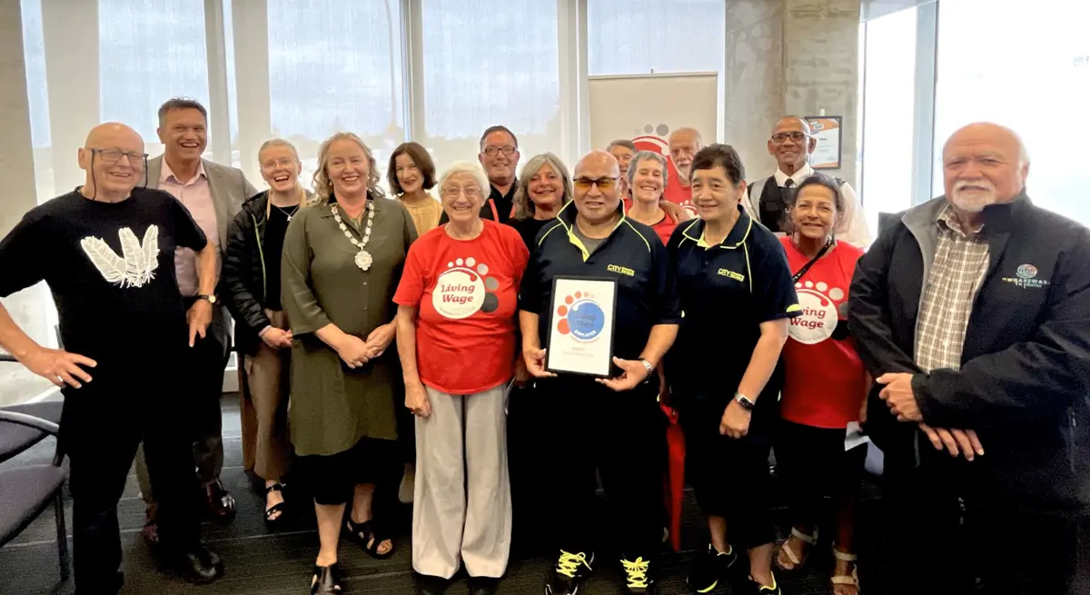 Living Wage Aotearoa representatives together with Mayor Janet Holborow, CEO Darren Edwards and Council staff celebrate the new Living Wage accreditation