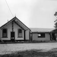 The Whakarongotai meeting house and the dining room under construction in 1979. Pictured are Ani Parata and Pehi Parata. HP 172, Bruce MacMillan Collection, Kāpiti Coast District Libraries. thumbnail