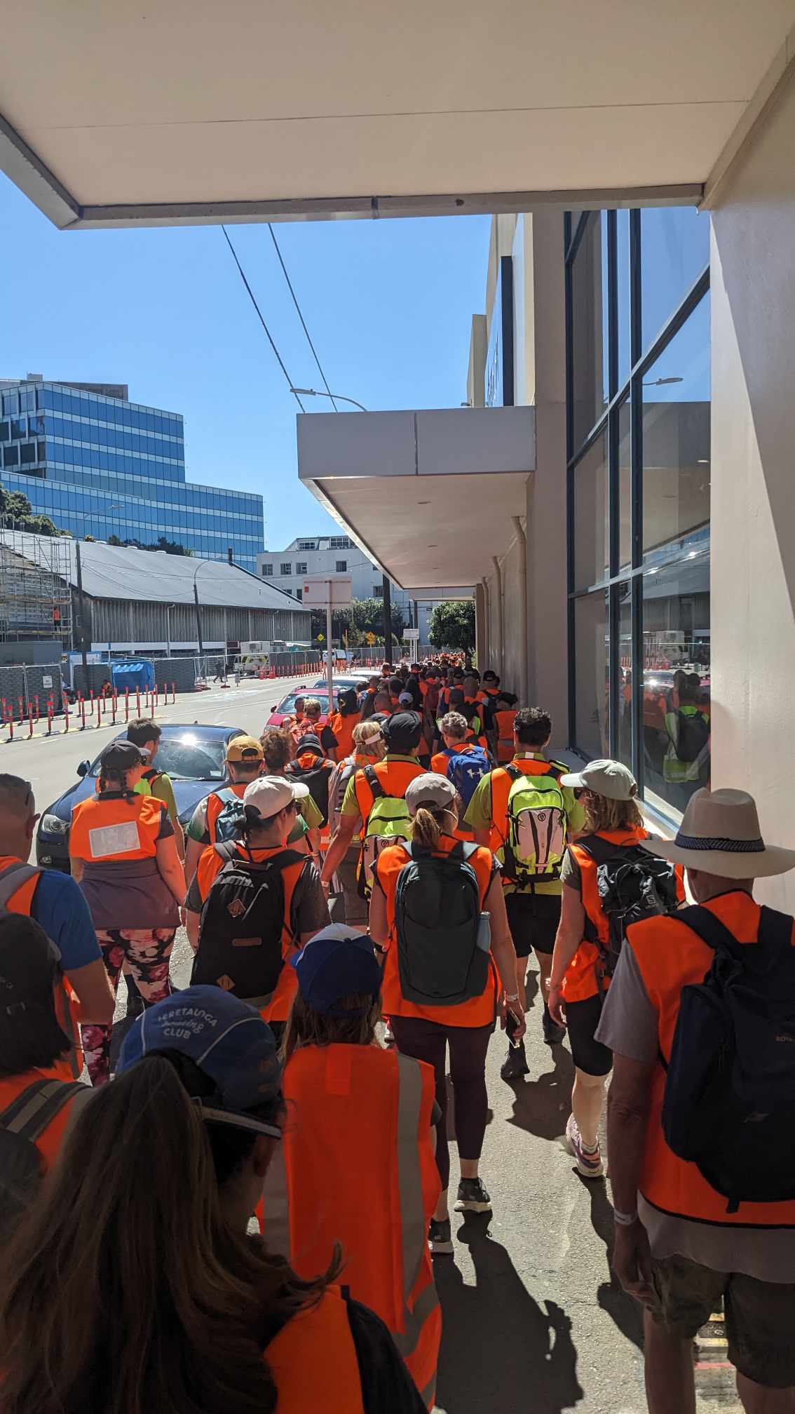 Participants on the Long Walk Home, organised by WREMO, walk though Wellington streets as they commence their journey to Porirua.
